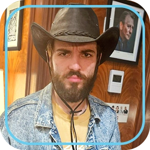 "We've Joined the Education Revolution" — photo of a young bearded man wearing a cowboy hat