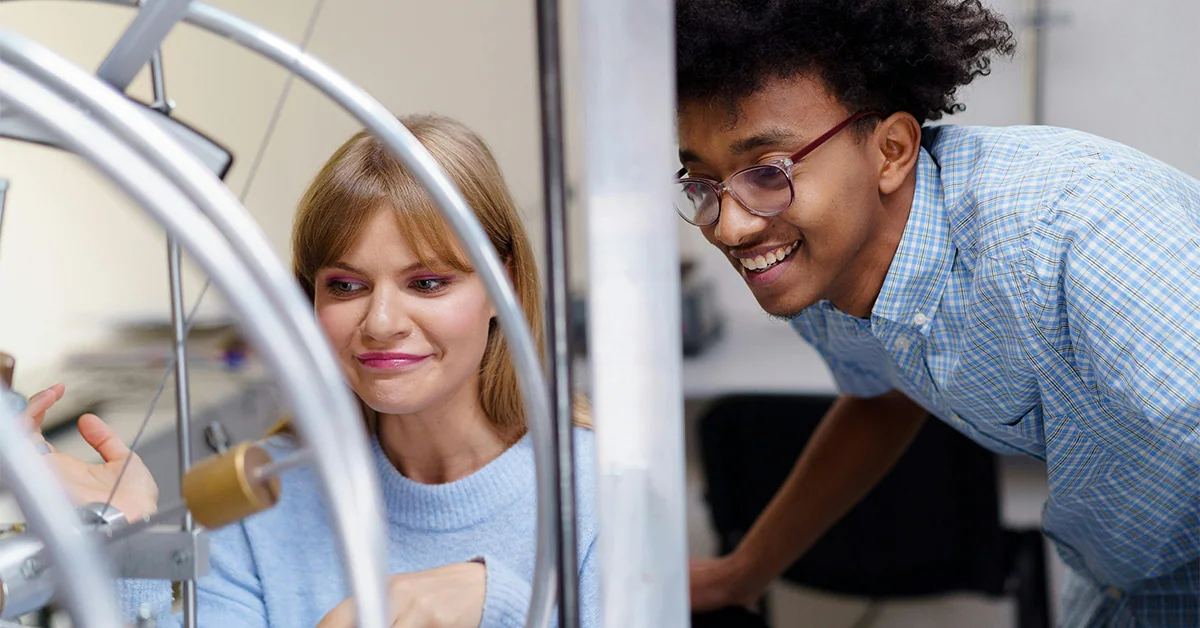 Photo of two students in a hands-on learning environment (Progressive Education article)