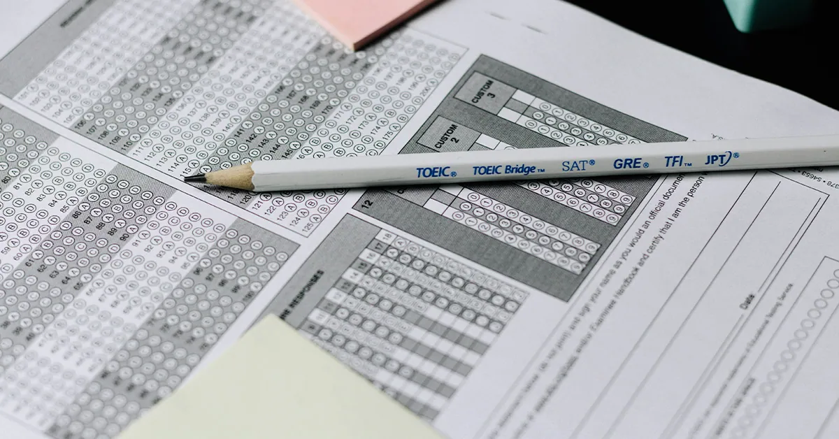 closeup photo of a number 2 pencil on top of a scantron sheet used for standardized testing (featured image: Teaching to the Test article)