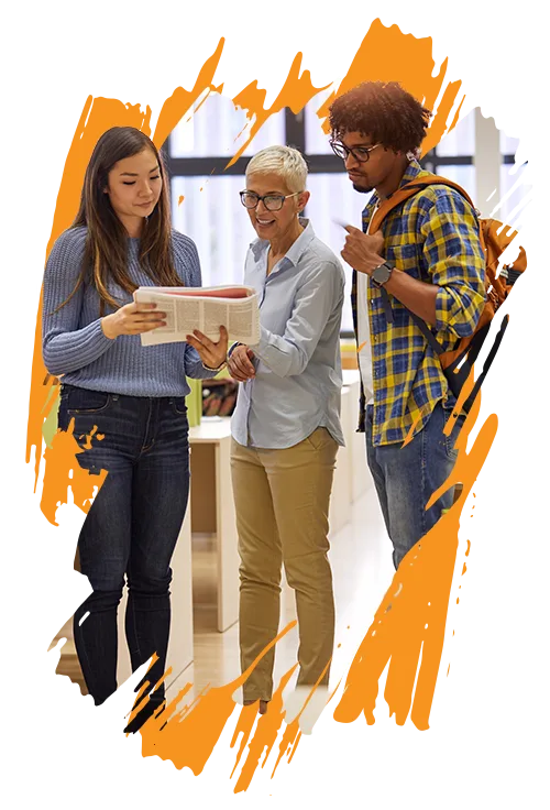 photo of a female teacher with short white hair and glasses talking to a male and female student (ERA Life Discovery curriculum)