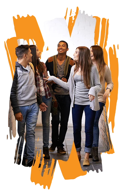 photo of a group of high school students laughing and talking in a school hallway