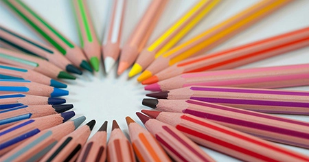 photo of colored pencils arranged in a circle in color order with their tips pointing toward the center (featured image: "Transforming Education Through Personalized Learning" article)